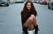 Pretty Brunette Squatting In The Street