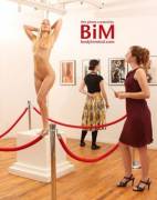 A Woman Viewing The Newest Exhibition At The National Maledom Museum, This Place ...