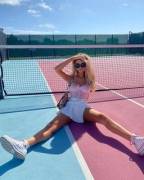 Stretched Out On A Tennis Court