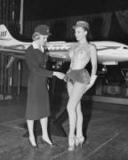 Swedish Stewardess Birgitta Lindman With The Swedish Sas Airline Examines A Showgirls ...