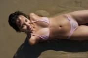 Soaking Wet And Smiling, As She Looks Up At You In A Pink Wicked Weasel Micro Bikini