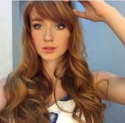 Gorgeous Redhead -- I Love The Contrast Of Long Waves And Longish Bangs.